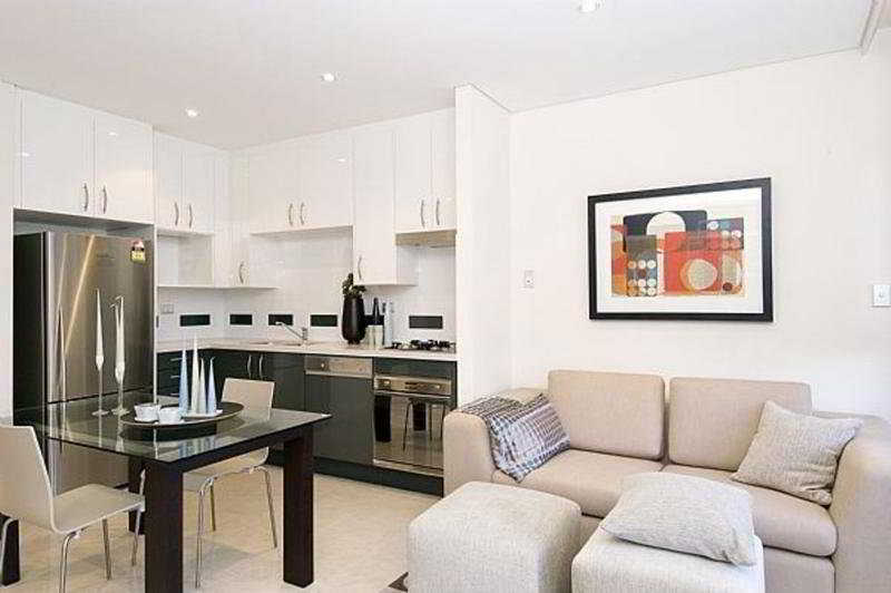 Meriton Suites Waterloo Сидней Экстерьер фото A living room with a kitchen